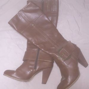 Brown below the knee boots.